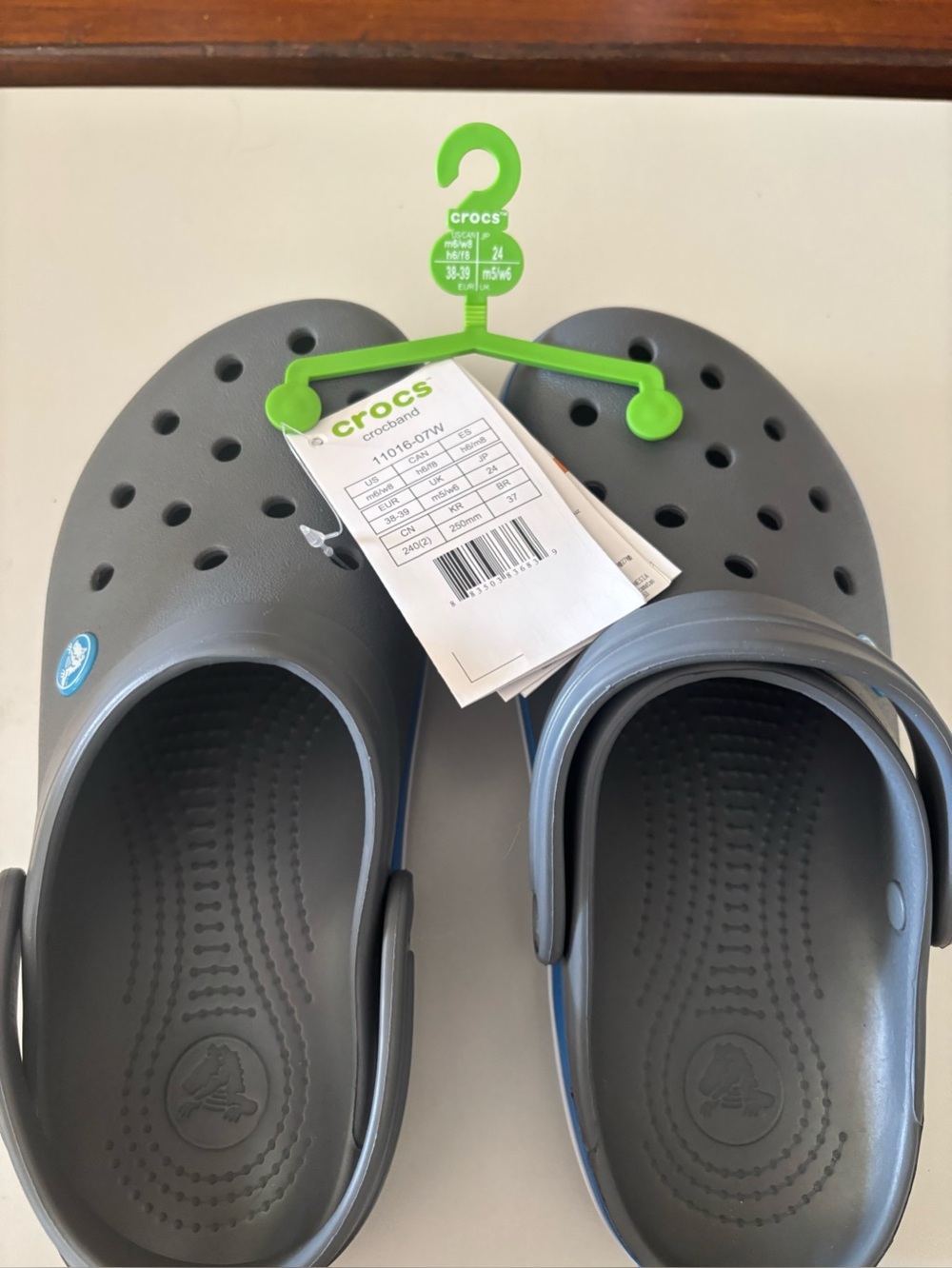 CROCS Classic Clogs in Gray with Blue Trim